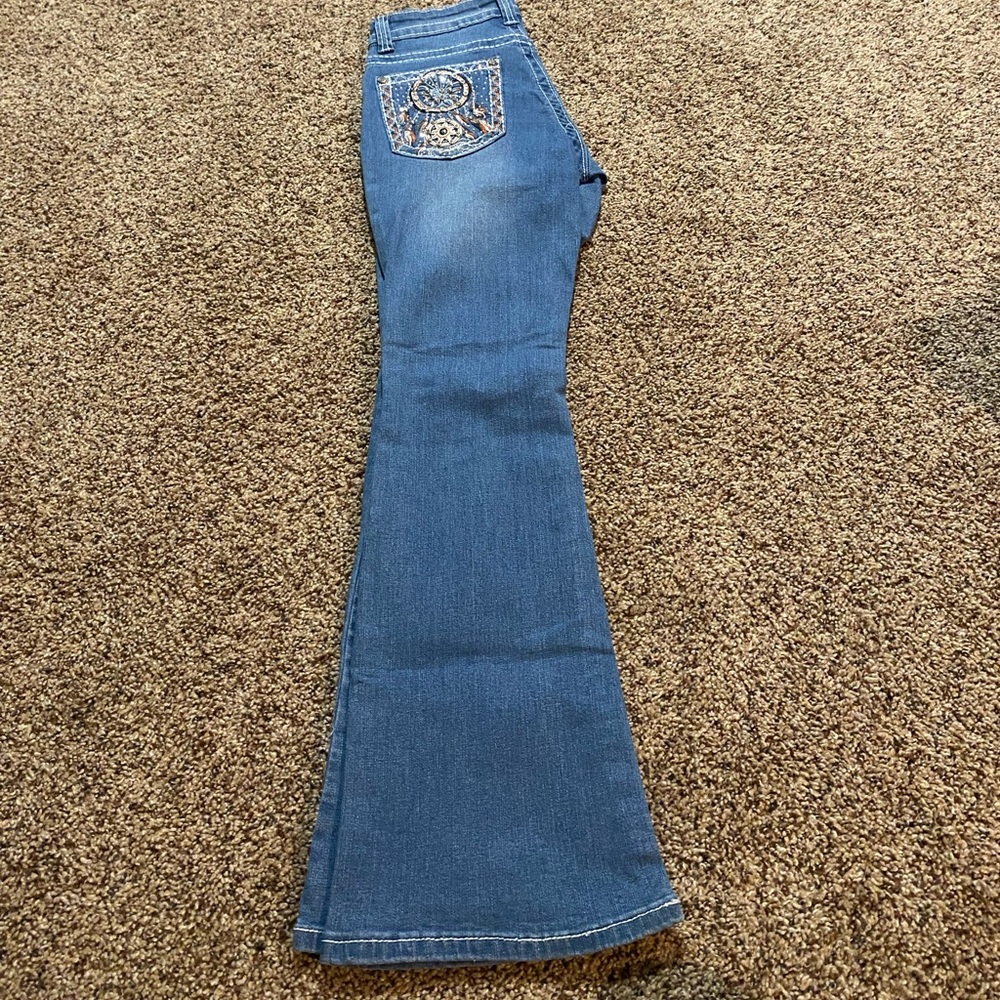 Flare Jeans, never worn, in good condition . Size 5/6.